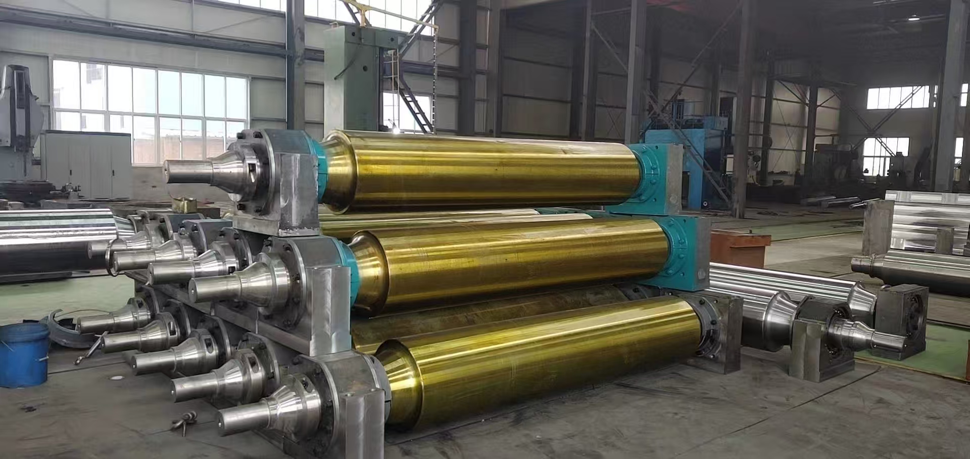 In quali applicazioni vengono utilizzati principalmente i componenti dei trasportatori a rulli scorrevoli?